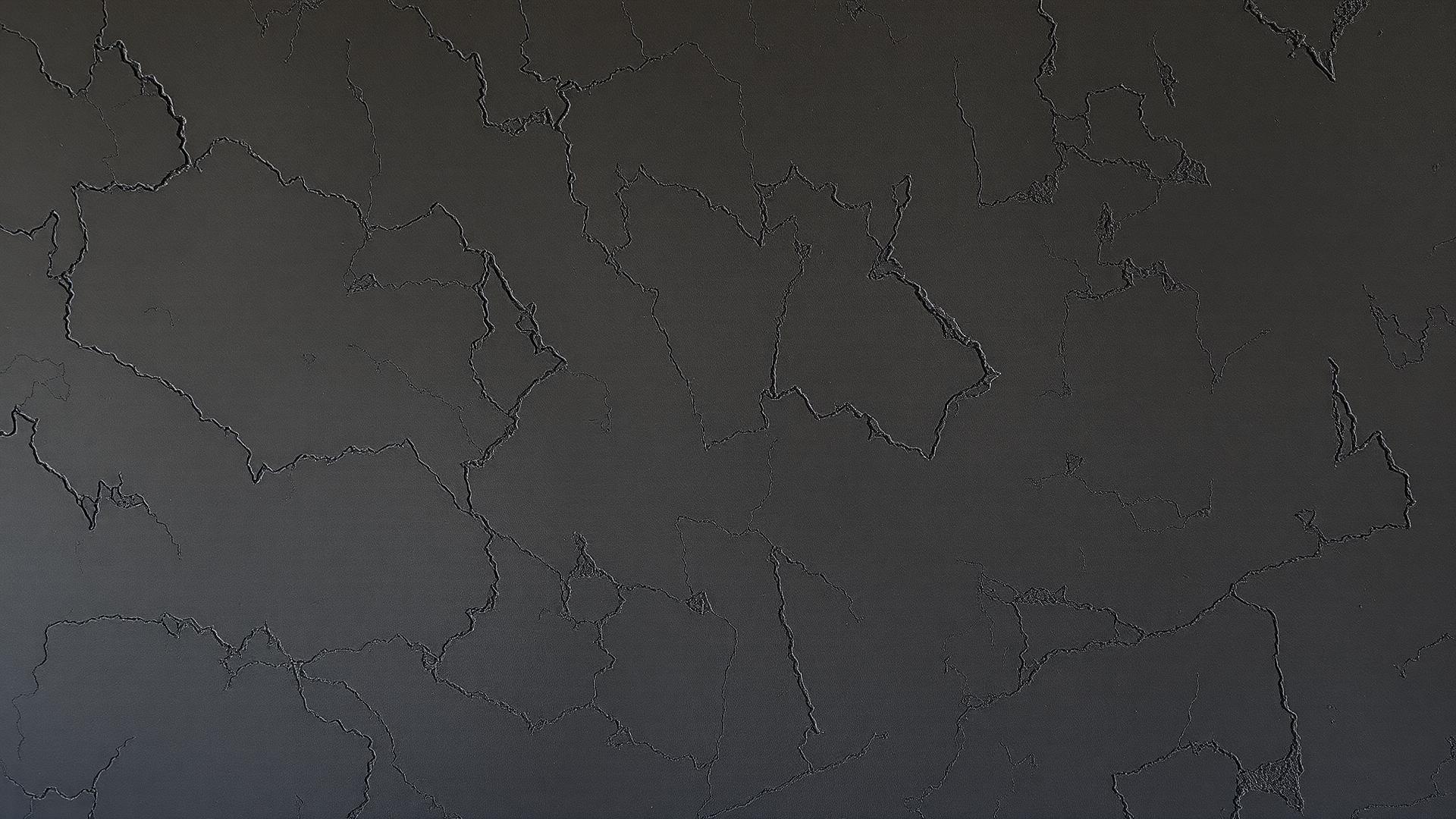 Venetian plaster wall lit by warm wall-washer lighting